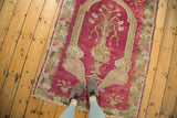 In-use view of an antique Armenian Karabagh rug, highlighting its rich blush tones and scale.