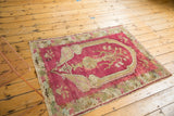 An antique Karabagh collector rug with a cochineal red field and tree-of-life prayer design.
