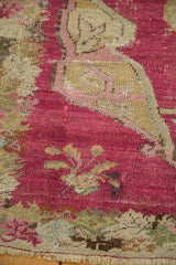 Detail showing etched knots and the exposed foundation of a collector Karabagh rug in cochineal red.