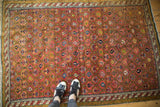 Antique Karabagh rug: intricate barber pole main border in antique ivory and navy blue.