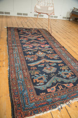 Vintage Mehreban runner with asymmetric dragon and floral motifs, indigo and madder red palette.