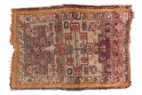 Antique Caucasian rug, geometric medallions in aubergine, tangerine, blush, silver; aged patina. 3'1