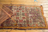 Antique Caucasian rug lower corner, with geometric vinery, tangerine border, and fringed tatter.