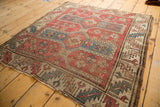 Avar style Caucasian rug corner, serrated leaf border of dusty rose, beige, sky blue, visible wear.