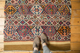Restored plain weave end of an antique Shahsavan Kilim fragment, revealing geometric crab motifs.