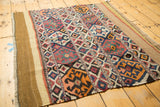 Antique Shahsavan Kilim rug fragment showing diamond crab motifs and restored plain weave end.
