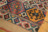 Geometric diamond patterns with crab motifs and plain weave restoration on an antique Shahsavan Kilim.