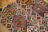 Hand woven antique Shahsavan Kilim fragment, displaying geometric panels, crab motifs, and restored plain weave.