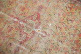 Antique Zuli Sultan rug detail showing worn knot heads, scattered holes, faded saffron gold pattern.