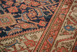 Vintage Malayer rug: navy, madder red Herati motif, beige border, localized wear.