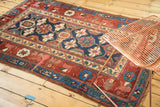 Antique Kurdish rug fragment, red field with indigo Mina Khani and arabesque motifs.