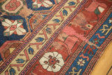 Antique Kurdish rug fragment detail: Mina Khani field and primitive arabesque border.