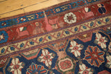 Antique Kurdish rug detail: Mina Khani floral cross-sections and stylized arabesque border in beige.