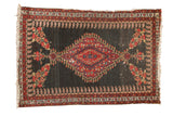Antique Persian Senneh rug, red scalloped medallion, dark field, floral corners, boteh borders.