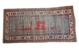 Antique Kazak runner, distressed blue-grey field exposing red foundation, with geometric borders.