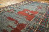 Articulated texture of a circa 1910s hand-knotted Kazak runner with cherry red and sky blue.