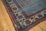 Collector Kazak runner border corner, with serrated Laleh Abassi motifs in red, blue, and ivory.