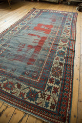 Aged geometric Laleh Abassi border motifs and texture on antique Caucasian Kazak runner.