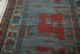 Patina-rich antique Caucasian Kazak runner with worn blue field, red foundation, and geometric border.