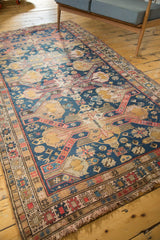 Antique Soumac rug corner, hand woven, with navy, red, gold geometric borders, patina, fringed.