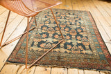 Antique Malayer rug corner, navy field with tree motif, blossoming floral borders, tattered fringe.