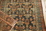 Intricate tree and shrub lattice on antique Malayer rug in navy blue, dusty raspberry.