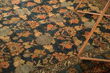 Detailed view of antique Malayer rug's intricate tree-and-shrub motifs, dusty raspberry and navy.
