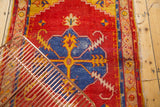 Sharp serrated contour, saffron yellow bursting tendrils of the blue Oushak medallion.