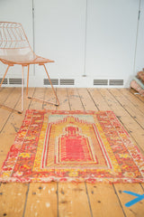 Frayed fringe and worn saffron yellow border of an antique Mudjur prayer rug.