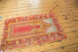 Antique Turkish Mudjur rug, showing tattered madder red and saffron gold borders.