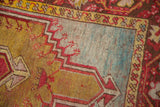 Detail of stepped pattern and starburst motifs in saffron yellow, powder blue, and madder red.