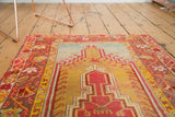 Antique Mudjur rug's saffron yellow and madder red geometric prayer design.