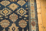 Detailed view of antique Malayer runner's indigo field, dusty gold motifs, and light tatter.