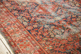 Antique Malayer rug detail: crimson, indigo henna motifs with mostly even pile wear.
