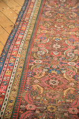 Intricate multi-color side borders defining the Herati pattern of this Antique Karabagh runner.