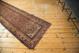 Antique Karabagh runner, showing naturally aged fringe and intricate geometric borders.
