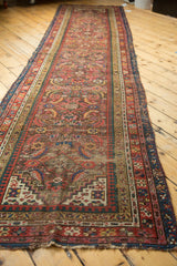 Antique Karabagh runner's intricate Herati design, geometric border, and aged fringe at the end.