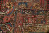 Textural detail of antique Karabagh runner's Herati design with visible tattered edge.