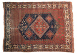 Antique Afshar rug, bold navy diamond medallion on a pomegranate red field, 4'2
