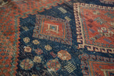 Early 20th century Afshar rug with geometric diamond and hook motifs, in navy and pomegranate.