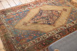 Secured side of the antique Bijar rug showcasing intricate tribal patterns in madder red and mallard green.