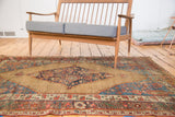 Natural camel hair field with sharp serrated tribal design on this antique Bijar rug.