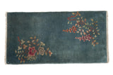 Vintage Chinese Nichols Art Deco rug runner, dusty blue-green field, asymmetric rose, tangerine, celadon florals.