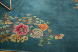 Detailed Art Deco floral bouquet with rose, orange, ivory blooms on a denim blue field.