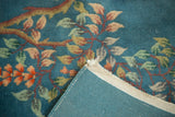 Vintage Nichols Art Deco rug corner with denim blue floral pile, woven reverse, and selvage.