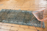 Worn vintage Hamadan runner showcasing its allover Herati pattern and Serbend border.