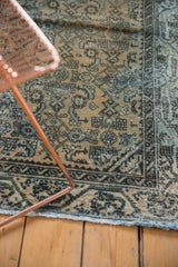 Distressed Hamadan runner corner, worn allover herati pattern, exposed foundation, and blue fringe.
