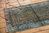 Distressed vintage Persian Hamadan runner, faded blue Herati pattern, visible foundation.