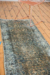 Allover herati motif and distressed texture on a vintage Hamadan runner in camel and blue.