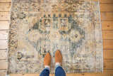 Distressed vintage Hamadan rug texture, geometric medallion in sand, ivory, seafoam green.